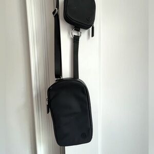 Black nylon Lululemon crossbody phone pouch with AirPods attachment